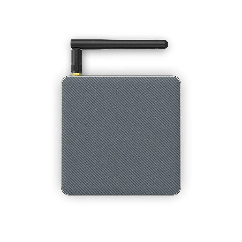Black Android set-top box with HDMI port, measuring 105x105x20mm, beside its remote control and power adapter.