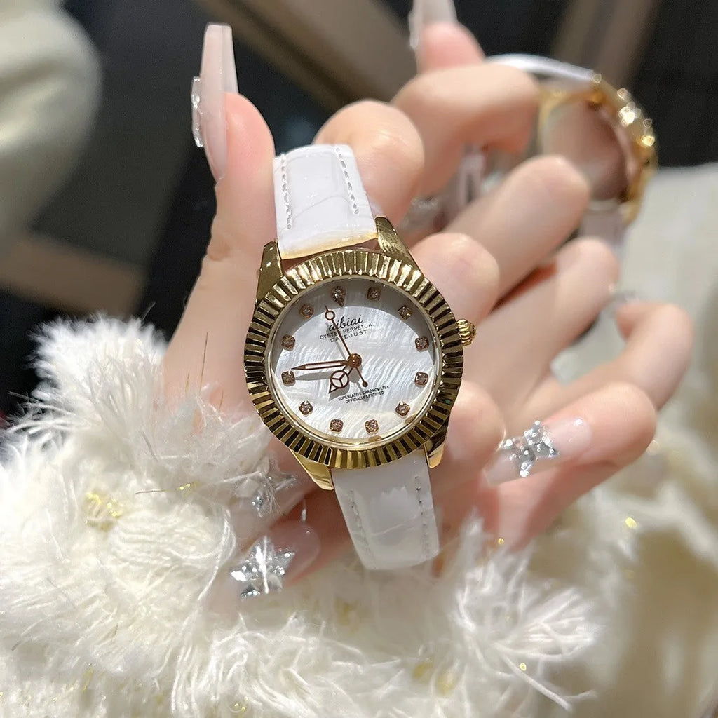 Women's rose shell dial watch with 7mm slim case, shown with leather or steel strap options