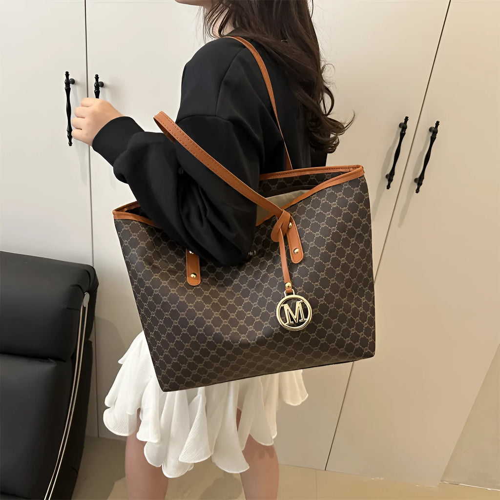 PU leather shoulder bag with sewing thread detail in black colour showing 42cm width and structured design