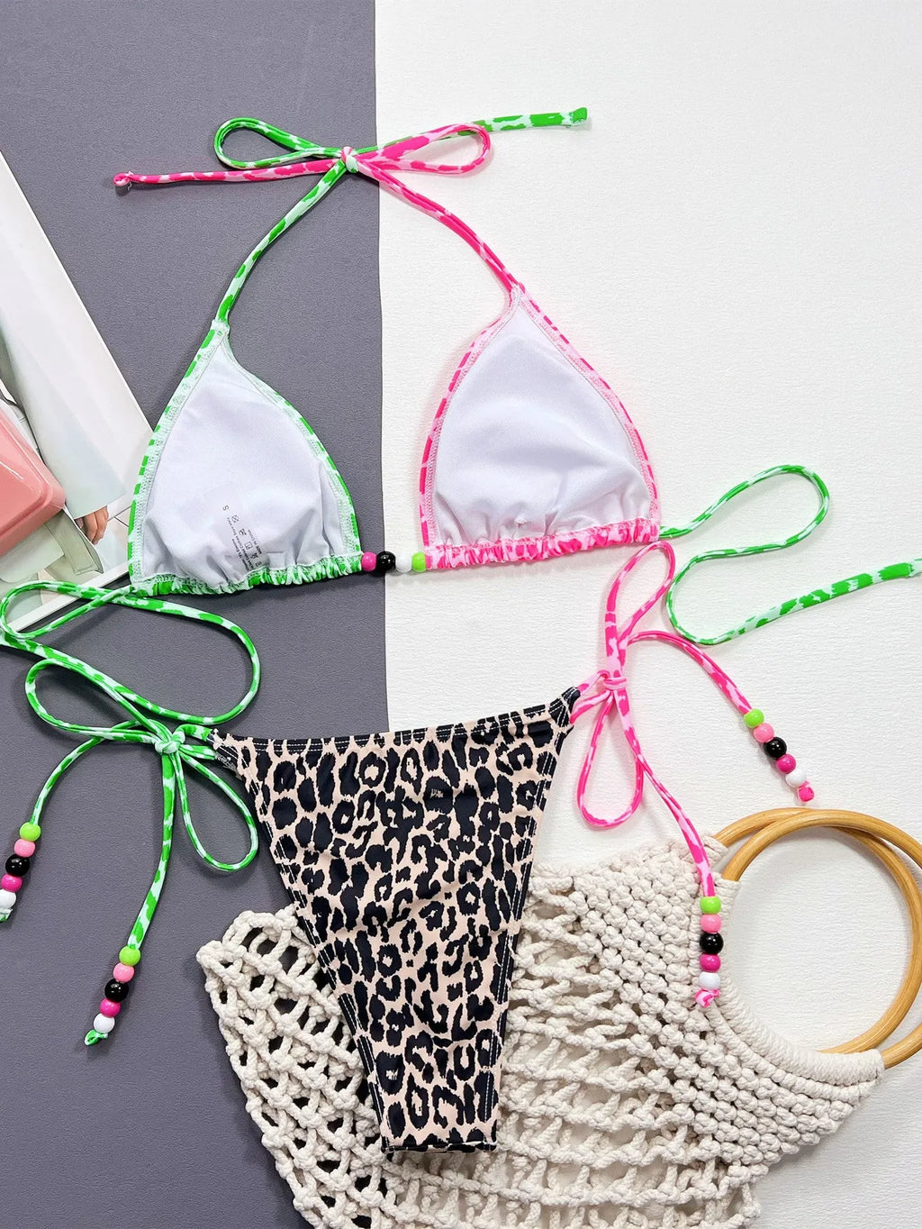 Women's leopard print bikini swimsuit with matching bra and briefs on size chart background