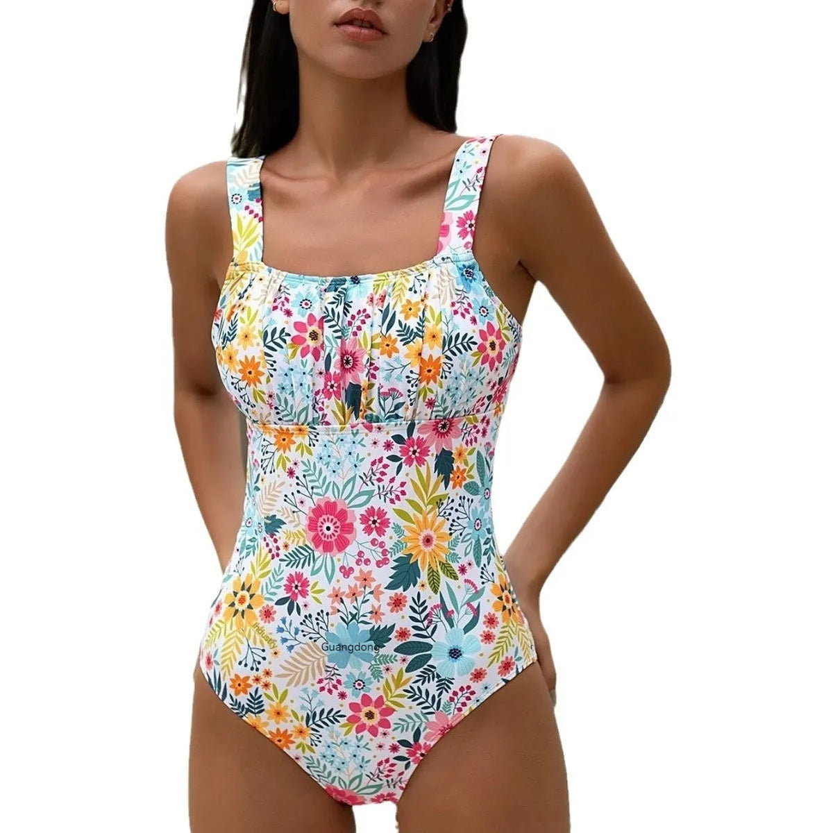 Women's one-piece swimsuit with blue floral print on black background, showing front and back views.
