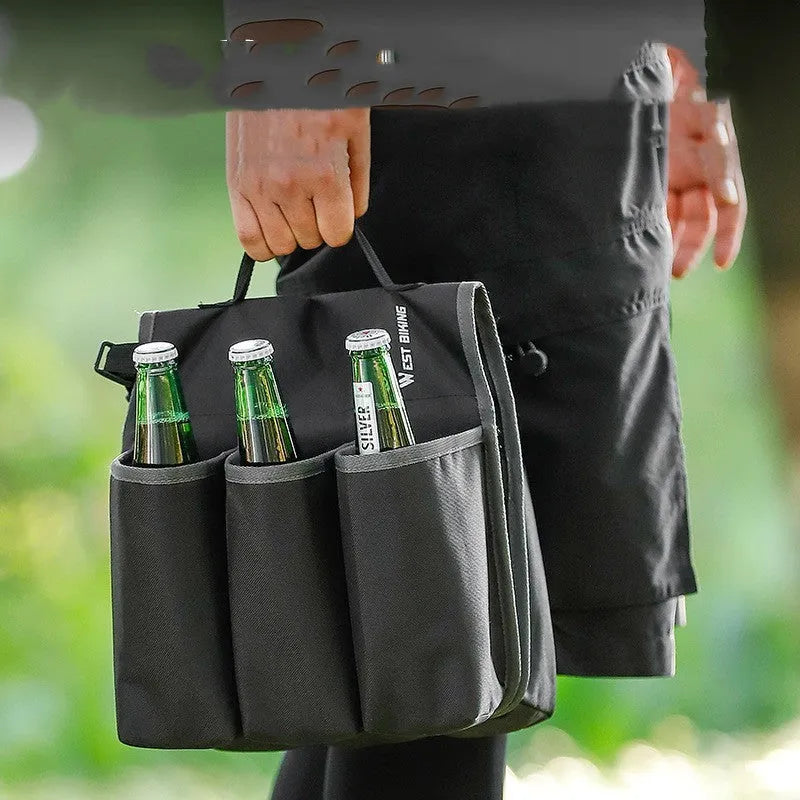 Black and orange double-sided bicycle drink bag made from 600D PVC mounted on handlebars.