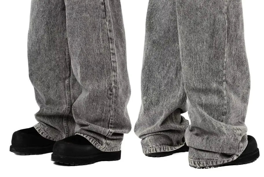 Grey loose fit straight-leg denim trousers for men and women on a mid-waist