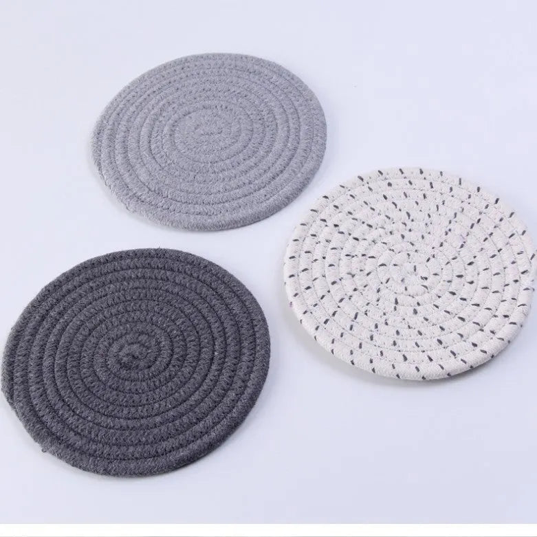 Three round 18cm cotton cord coasters in a set, shown in a blue colour option.