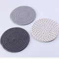 Three round 18cm cotton cord coasters in a set, shown in a blue colour option.
