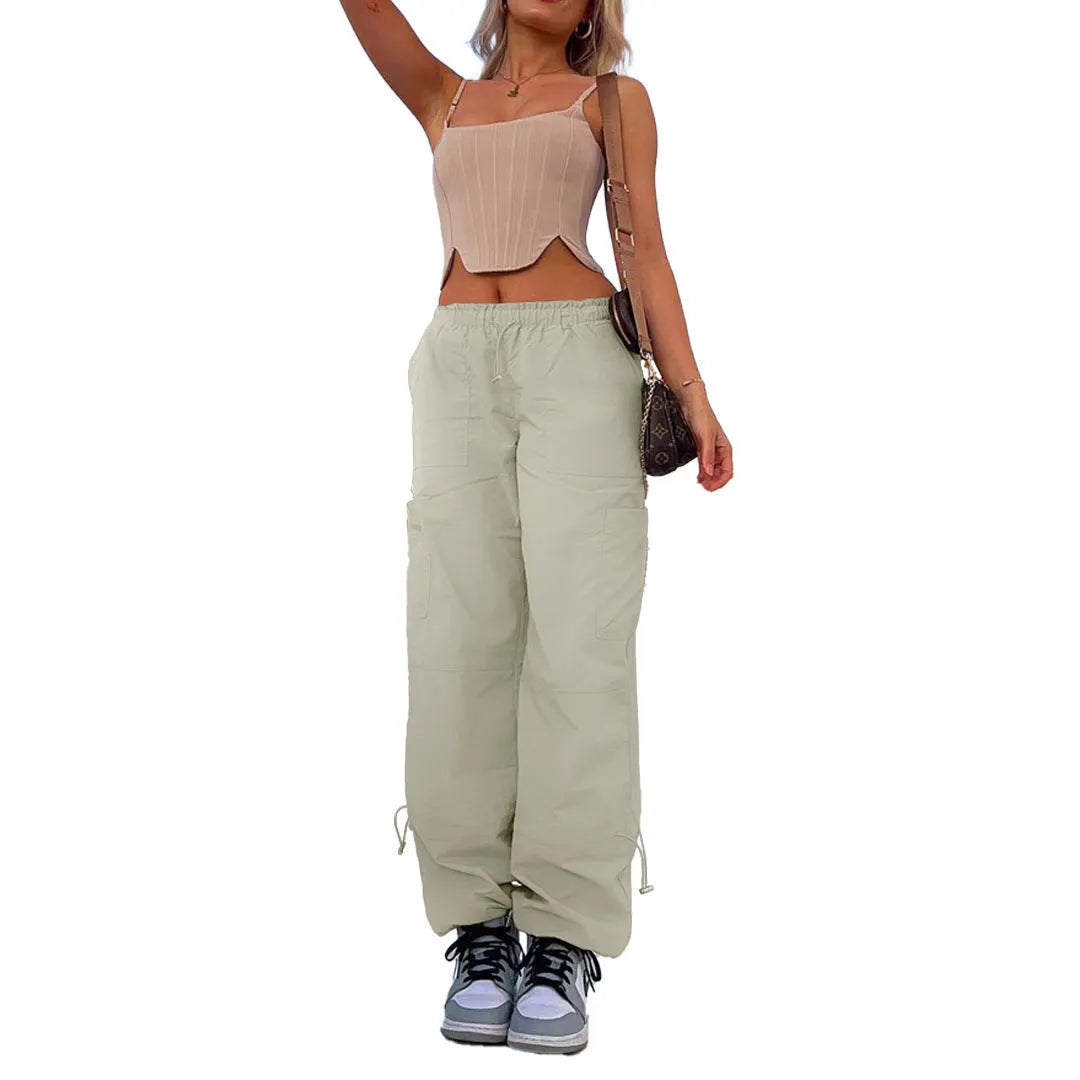 Man wearing loose-fit khaki coloured cargo pants with multiple pockets, straight leg design.