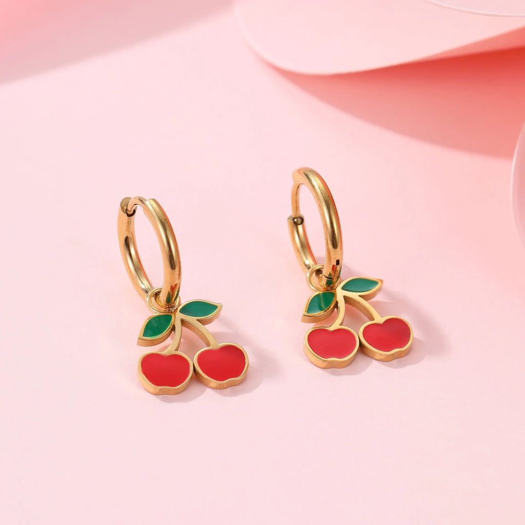 Stainless steel cherry jewellery set showing necklace, bracelet, earrings, and ring with geometric design.