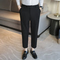 Straight leg brown corduroy trousers for men laid flat, showing texture and elastic waistband.
