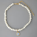 Geometric sterling silver pendant necklace with irregular freshwater pearls on an adjustable silver chain
