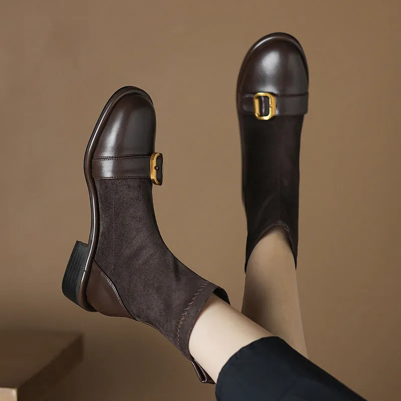 Black women's low heel Martin boots with front lace-up and buckle detail stitching.