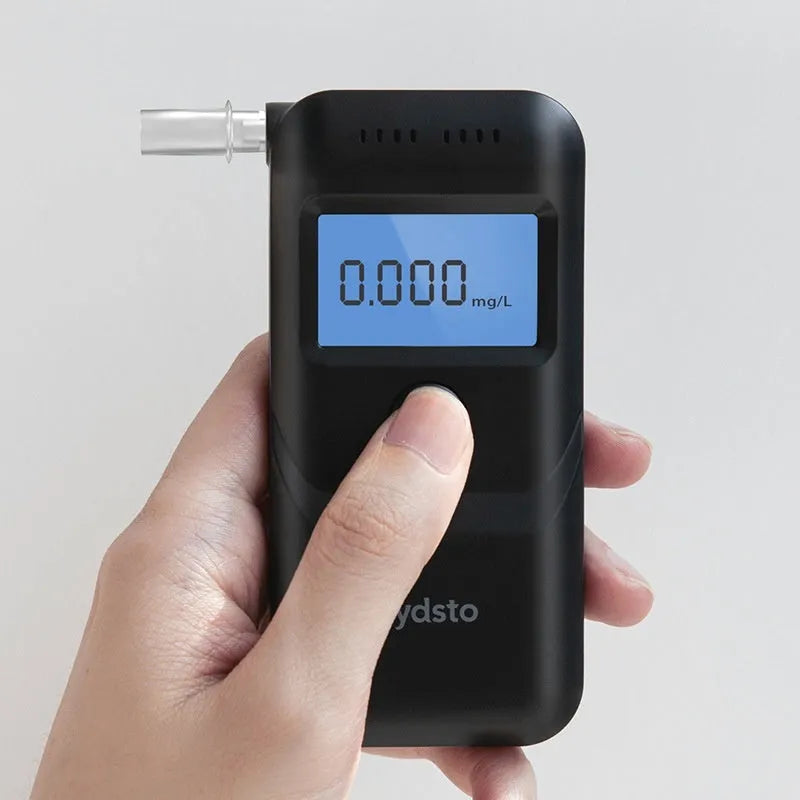 Black household alcohol tester for breath analysis and driving checks