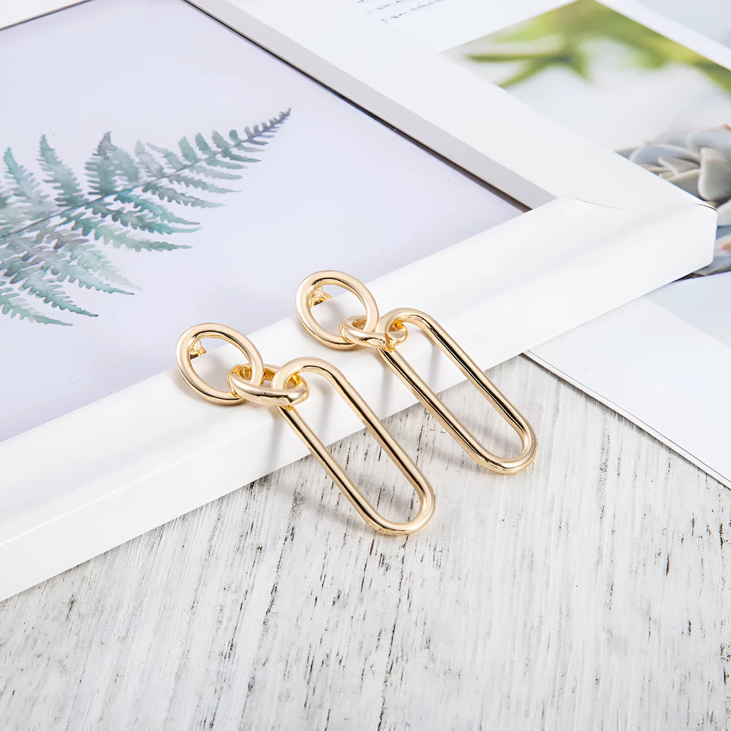 Sterling silver needle coloured geometric hoop earrings with ring and line design elements