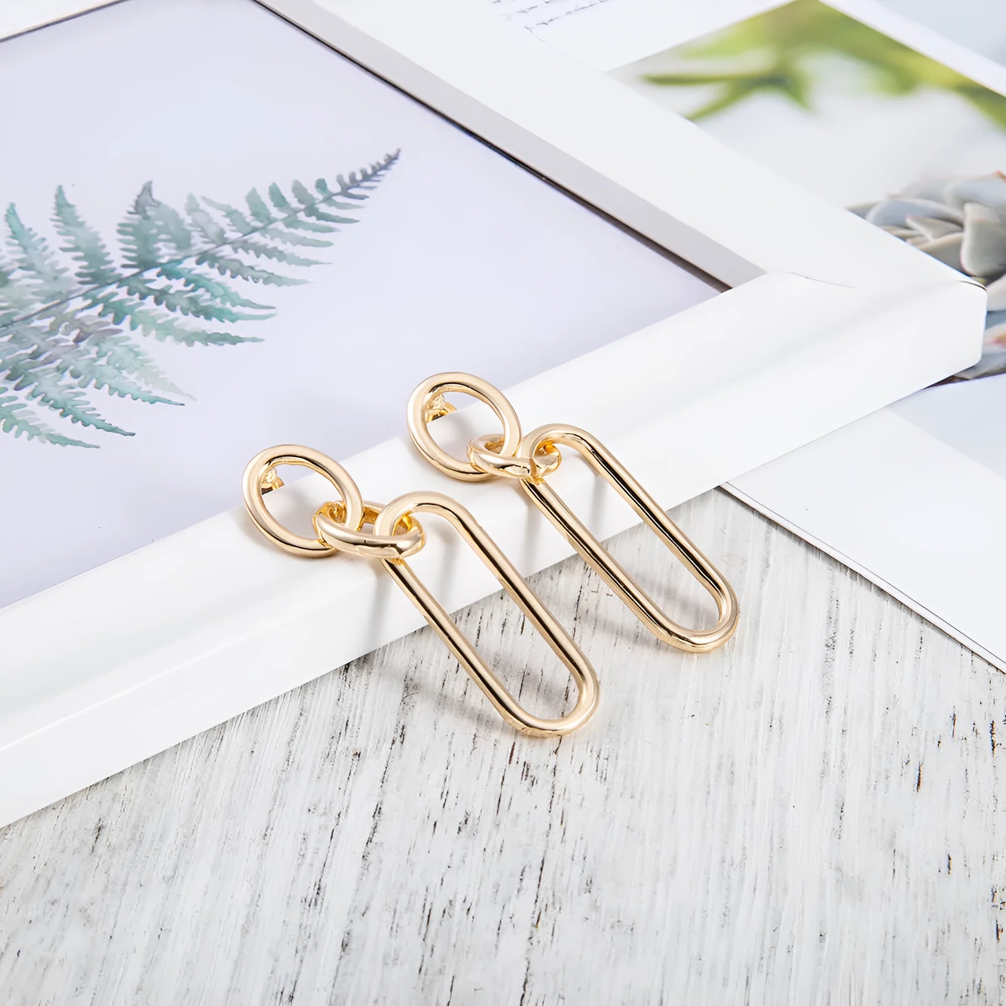 Sterling silver needle coloured geometric hoop earrings with ring and line design elements