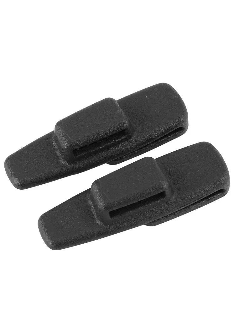 Two black plastic car safety belt clips for adjustable seat belt tension.