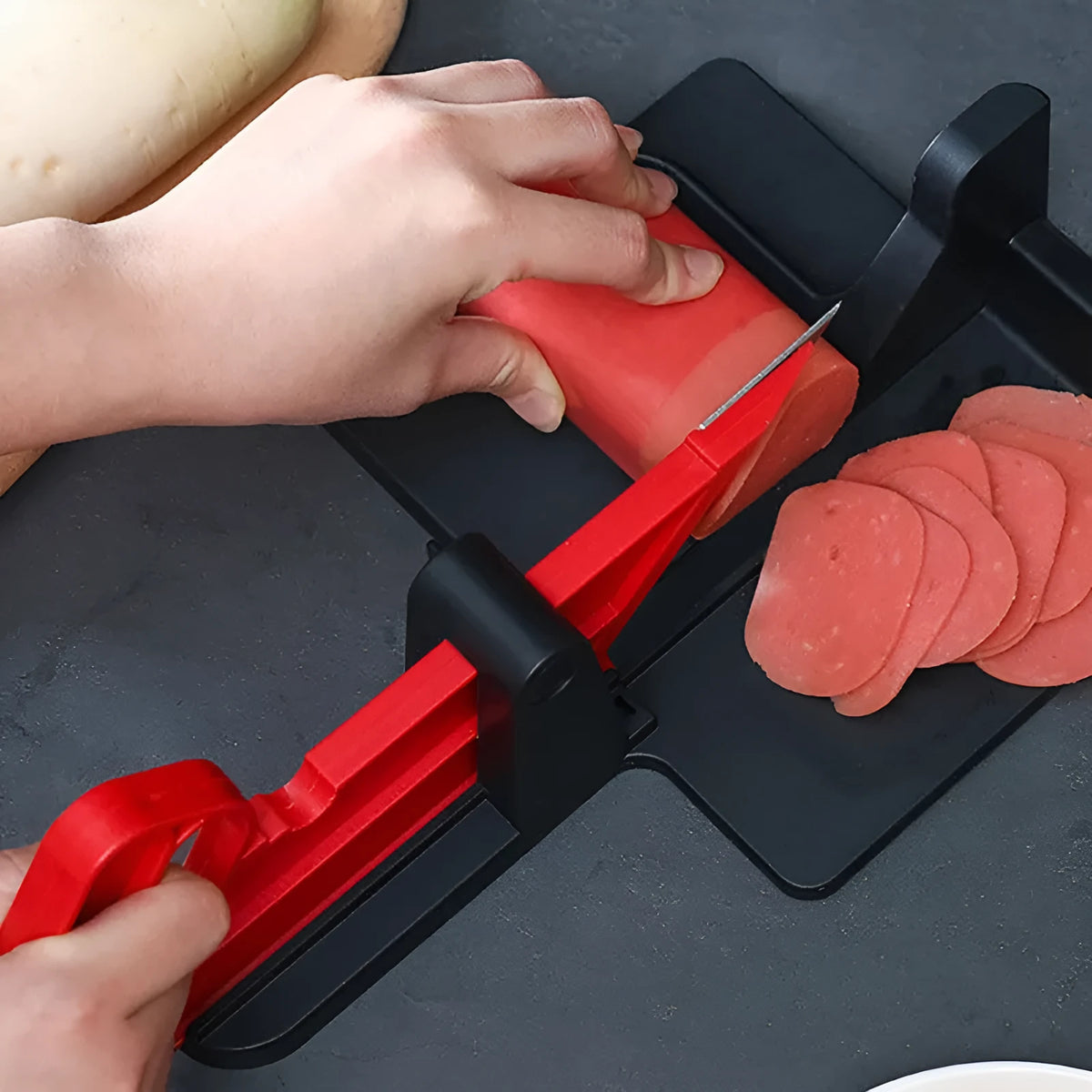 Green and red plastic vegetable cutter with stainless steel blades for carrots and potatoes