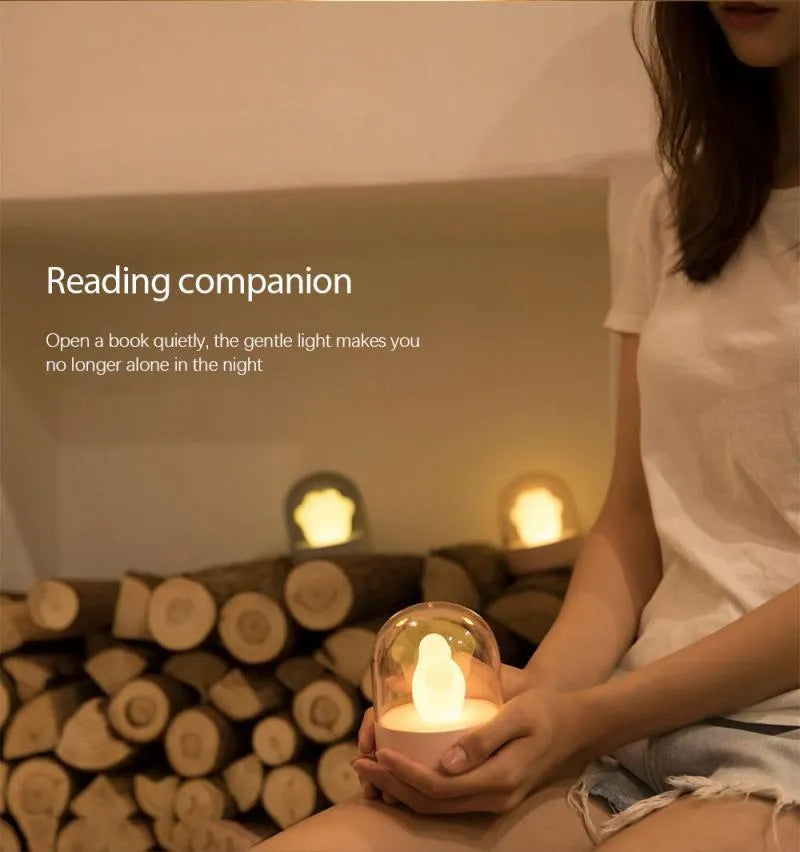 Grey cat paw shaped night light with USB charging cable and adjustable brightness controls