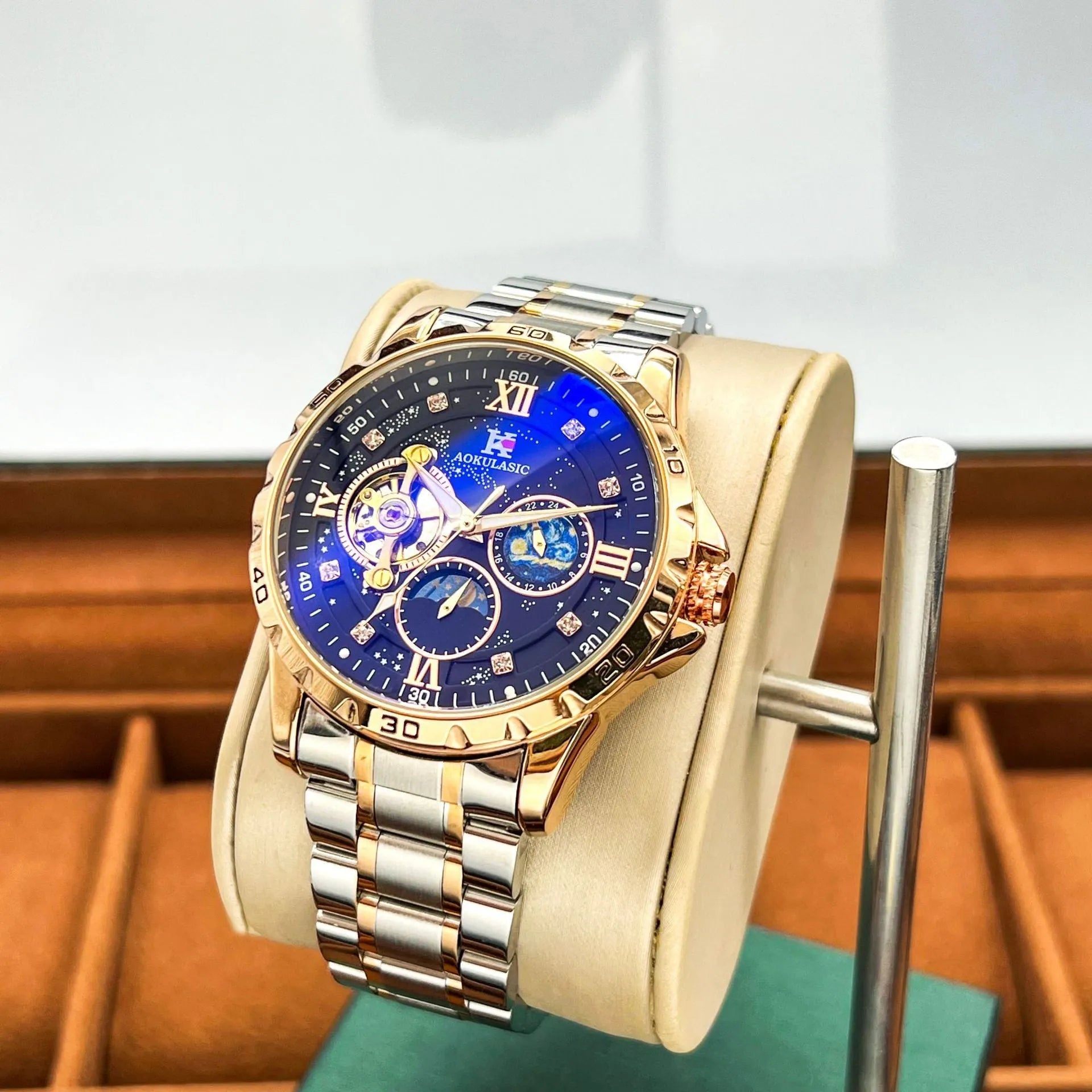 Men's automatic mechanical watch with rose gold shell case and black dial face showing 12mm thickness