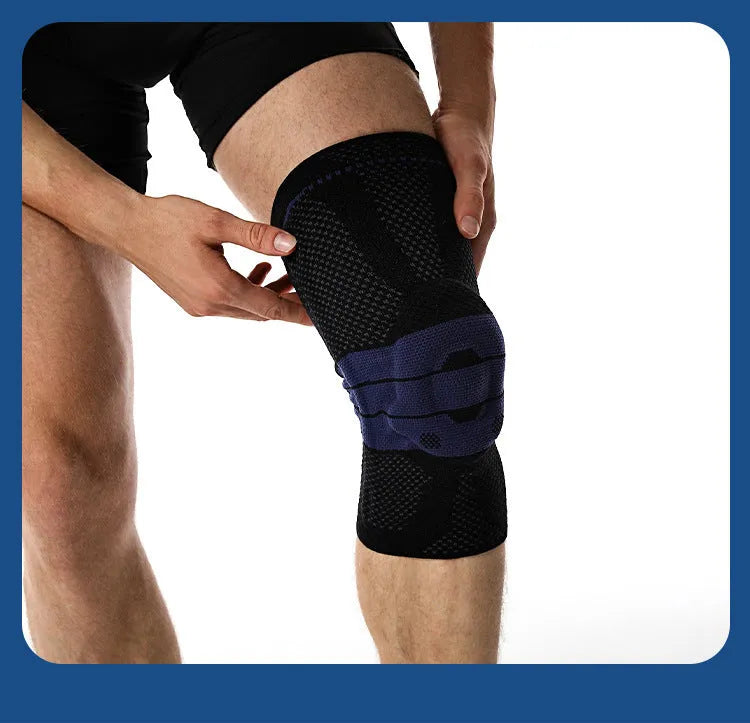 Adult black and blue sports knee pads made from nylon and spandex, shown on a knee.