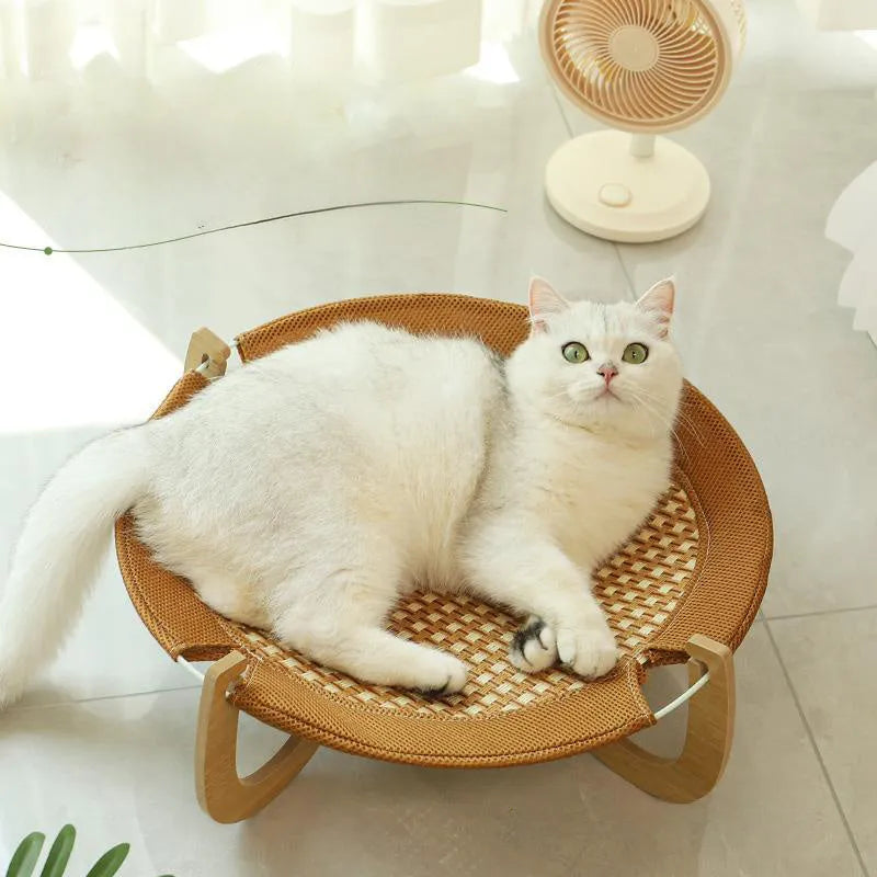 Brown woven rattan hammock pet bed measuring 46cm square with elevated design
