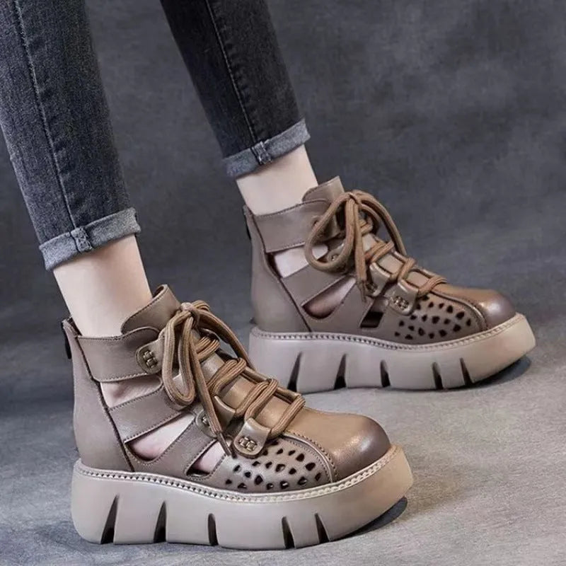 Women's black platform sandals with hollow hole design and fish mouth toe in soft cowhide leather.