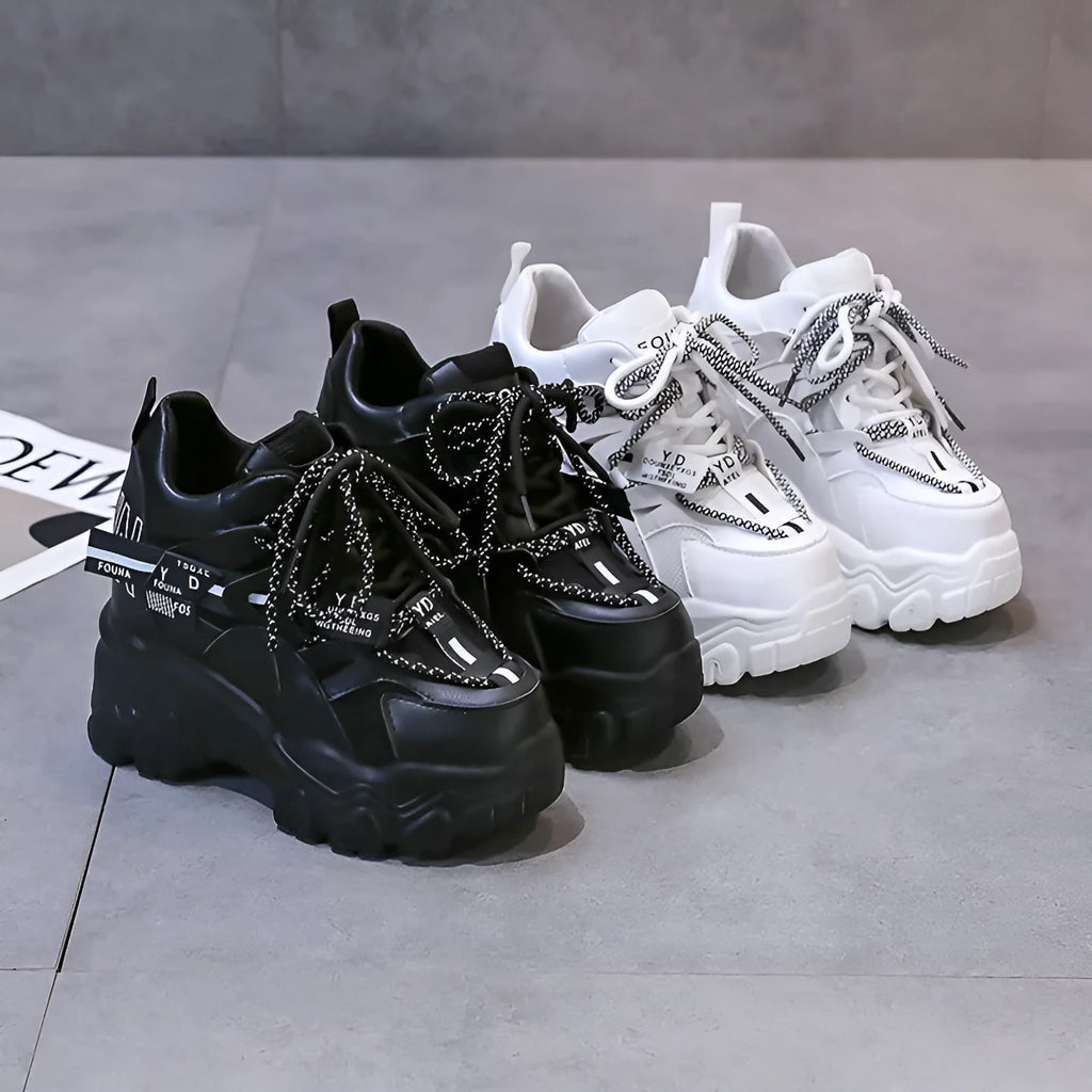 Women's white breathable mesh platform sports shoes with a cross strap and rubber sole.