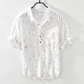 Men's loose fit summer polo shirt in white or black with lapel collar and short sleeves