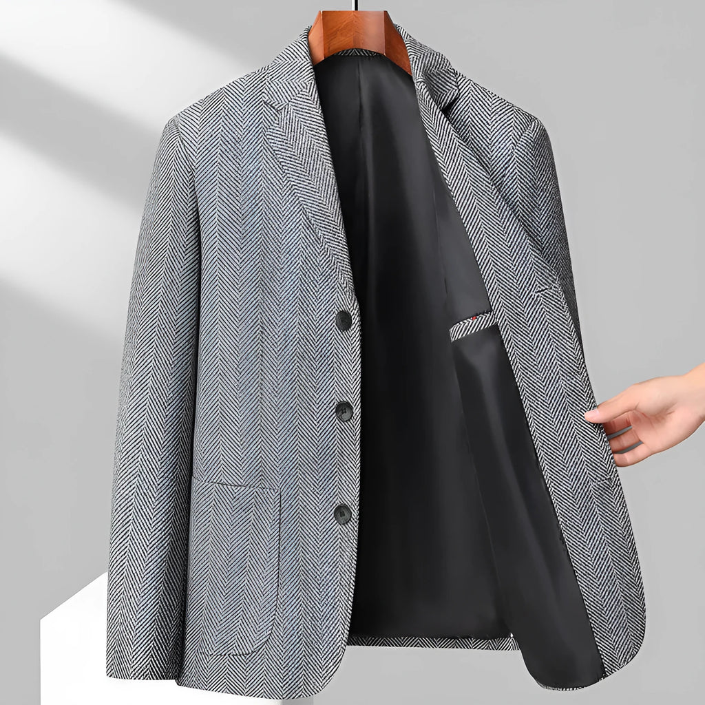 Man wearing a classic solid-colour, loose-fit wool blend coat suitable for spring and autumn.