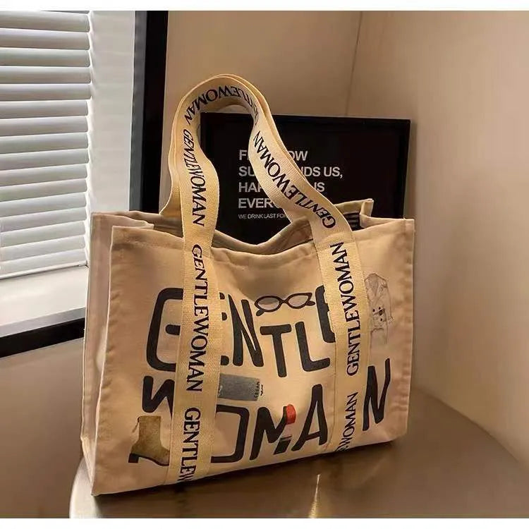 Canvas tote bag with printed design, large capacity for shopping and travel
