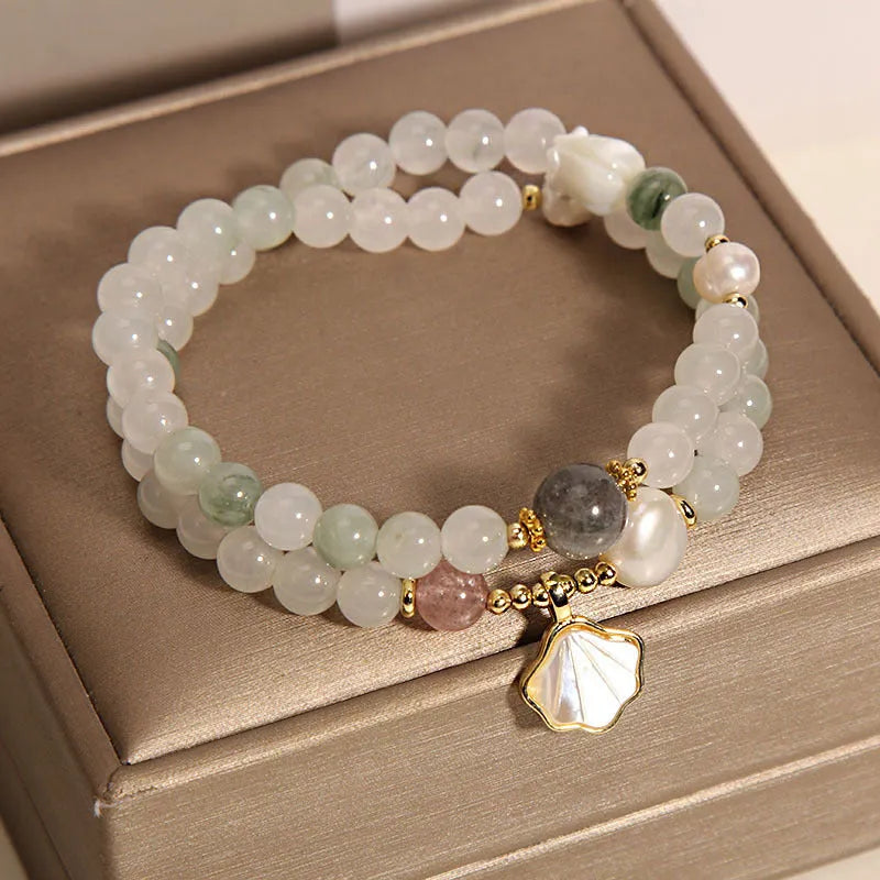 Gold-plated crystal bracelet for women with a Tianshan jade green ginkgo leaf pendant and rhinestones.