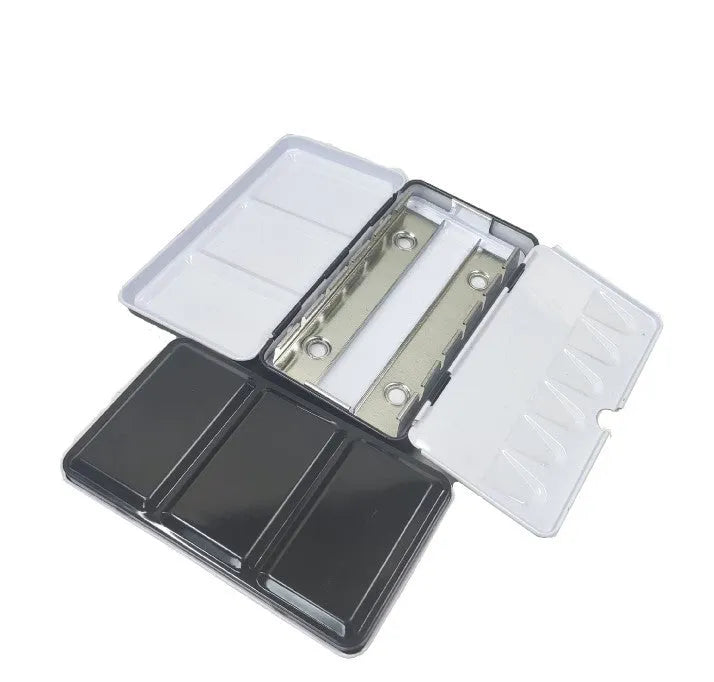 Tinplate metal watercolour paint box with folding compartments for solid pigment storage