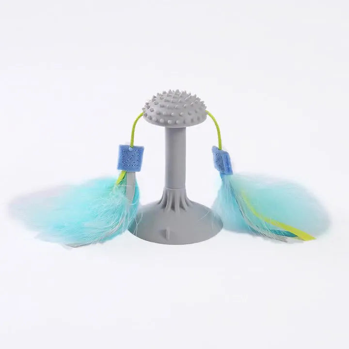 Blue cat toy wand with suction cup, double haired prick head, and plastic grinding teeth element.