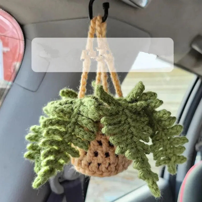 Green and white knitted wool car plant decoration with plastic base and hanging rope