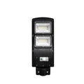 Integrated solar street light with solar panel and LED light in single housing unit for outdoor installation