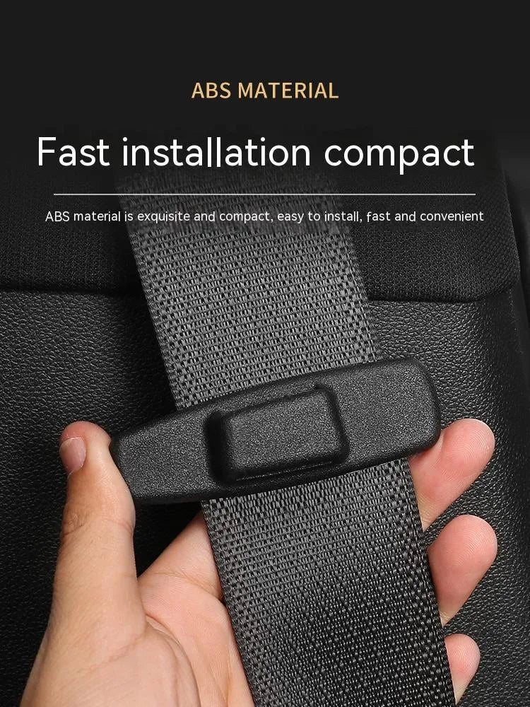 Two black plastic car safety belt clips for adjustable seat belt tension.
