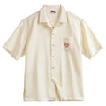 Light apricot men's Cuban collar shirt with bamboo plant and flower pattern