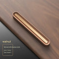 Long strip car aromatherapy ornament in walnut colour, shown clipped to a car air vent.