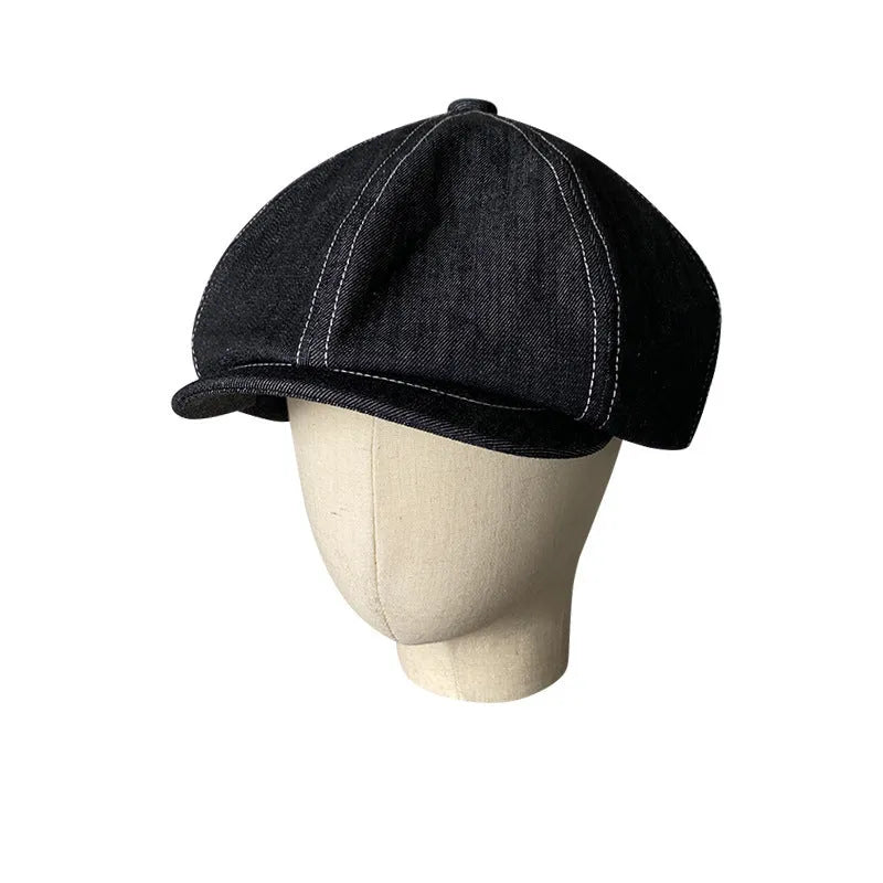 Black cotton retro beret with octagonal silhouette shown on model, unisex adult design