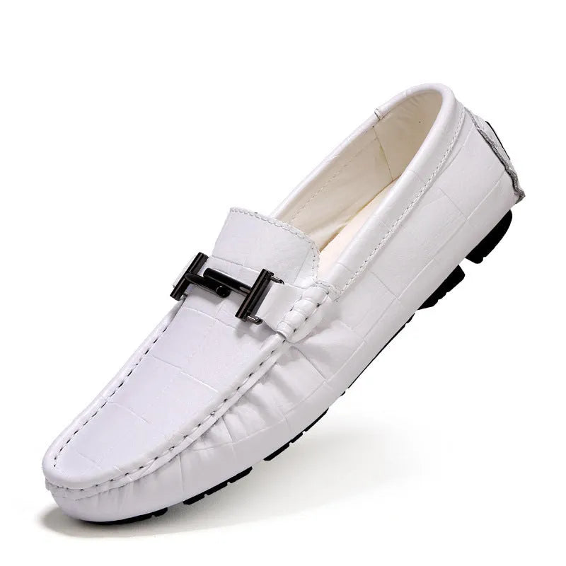 Men's black leather casual shoes with a silver buckle on a flat rubber sole.
