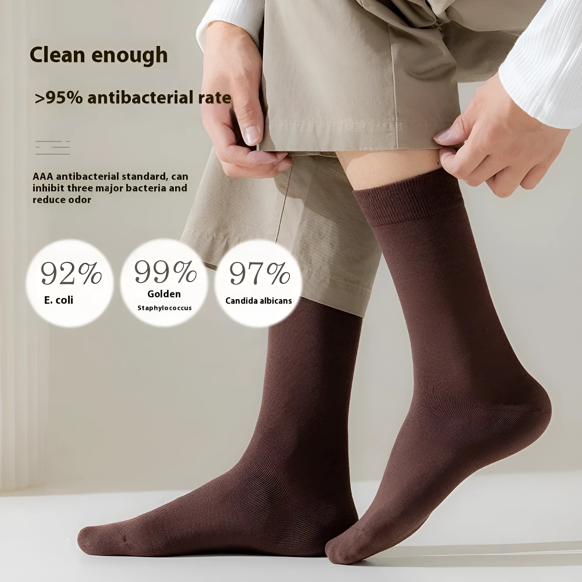 A pair of solid colour men's mid-calf socks in combed cotton, shown in a light grey shade.