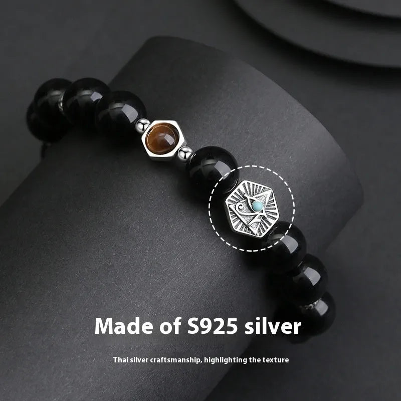 Men's geometric S925 sterling silver bracelet with a central God's Eye obsidian stone inlay.