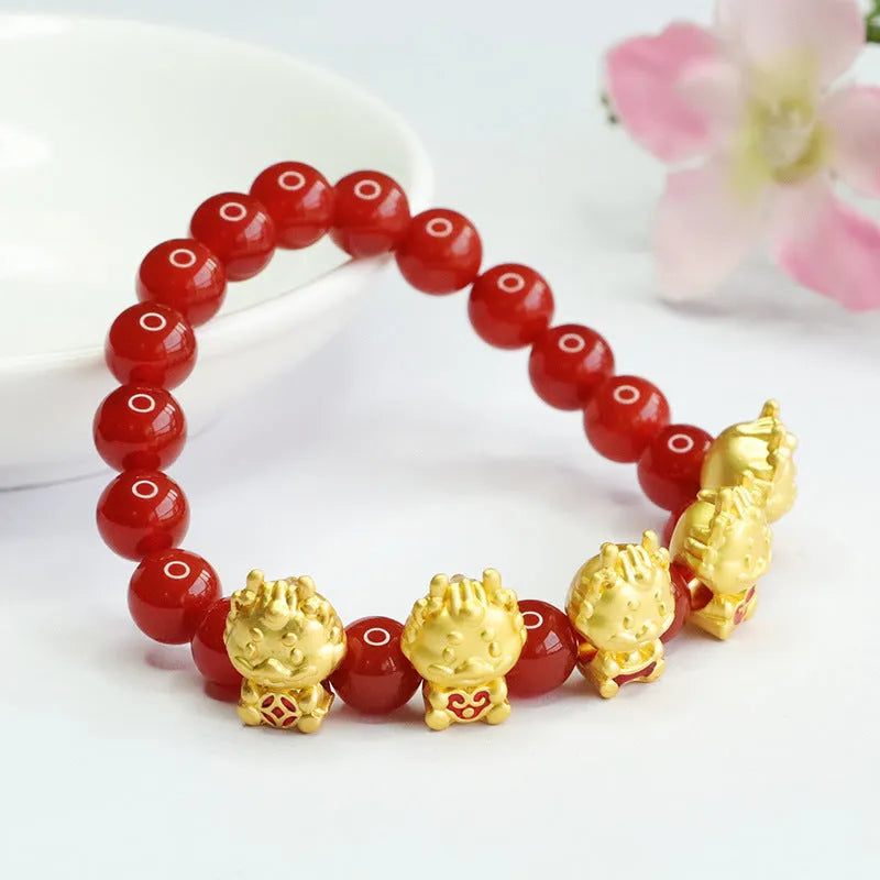 Close-up of a red agate bracelet bead carved with a Chinese Five Blessings Dragon design.
