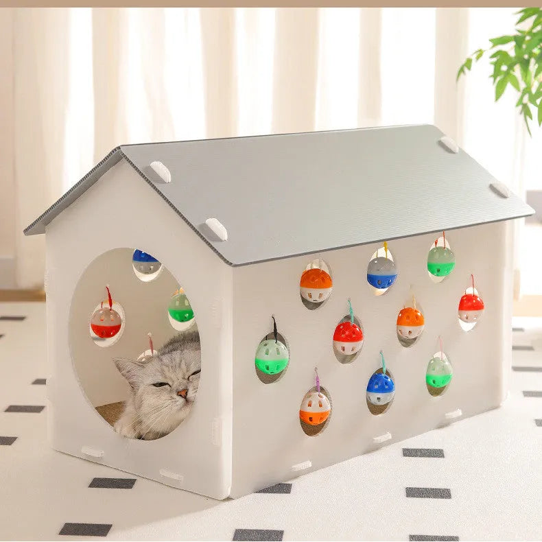 Plastic cat scratch board and bed integrated toy with a built-in tunnel containing a bell ball.