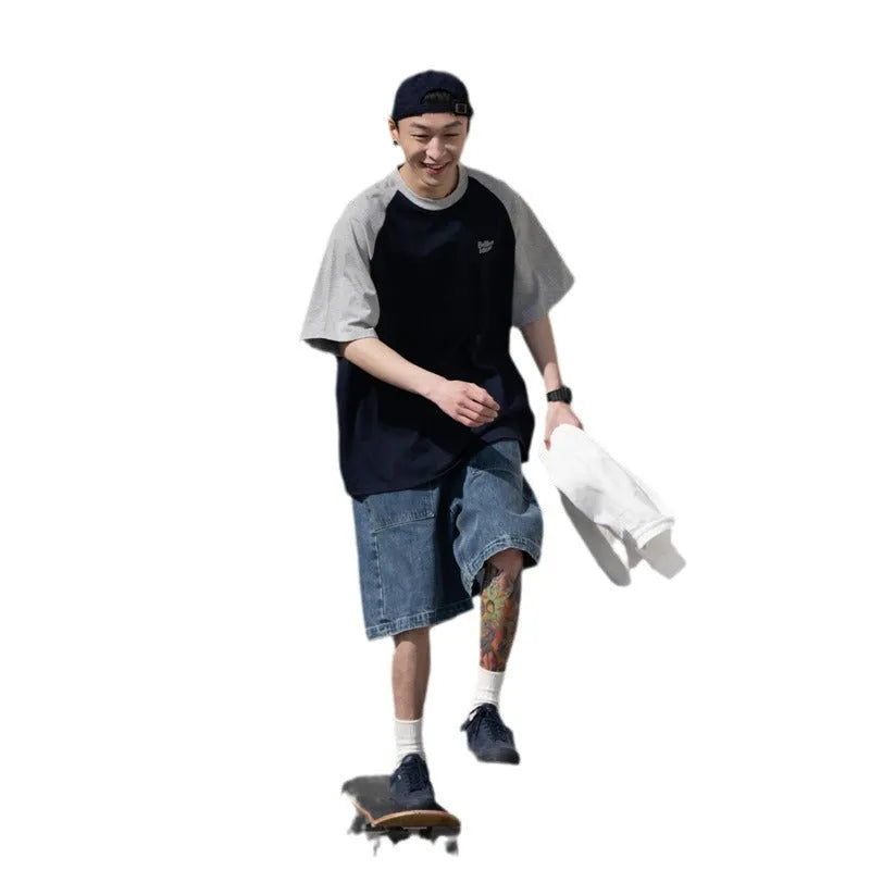 Men's blue loose-fit casual t-shirt with raglan sleeves on a hanger.
