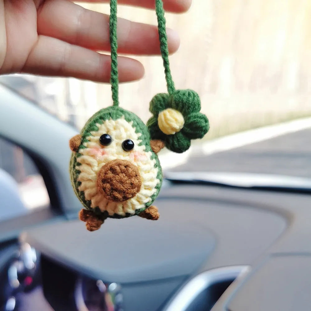 Handmade crocheted wool car pendant in avocado colour with rainbow flower design