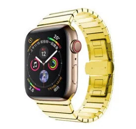Silver stainless steel Apple Watch strap with butterfly buckle on a wrist.