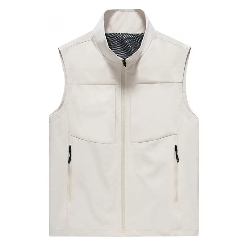 Man wearing a khaki stand collar cardigan vest with zipper pockets outdoors.