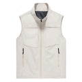 Man wearing a khaki stand collar cardigan vest with zipper pockets outdoors.