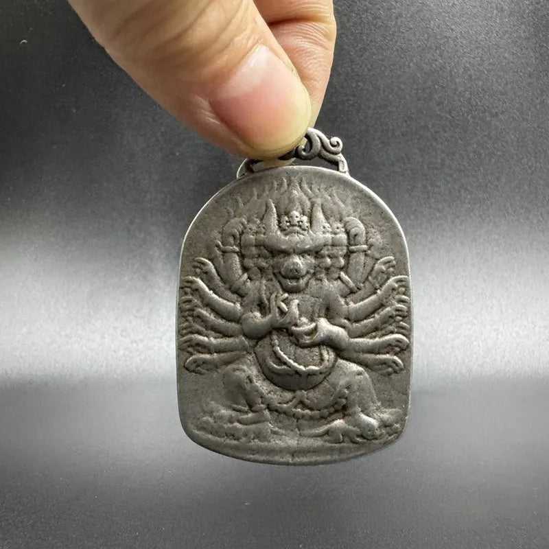 Chinese-style cast iron pendant ornament with Aryaacalanatha Yamantaka geometric design.