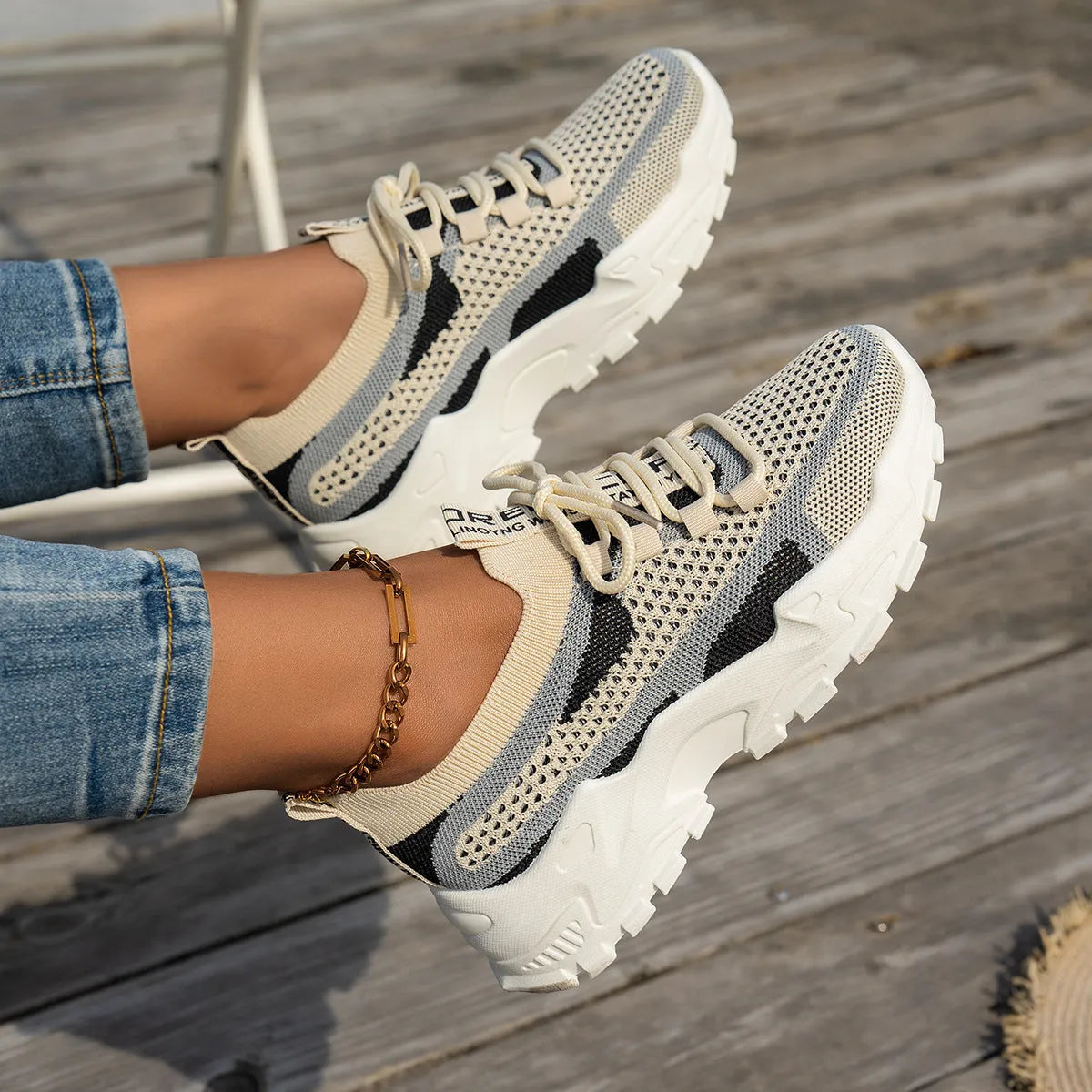 Women's flyknit mesh sneakers with rubber sole and lace-up design in black and gray