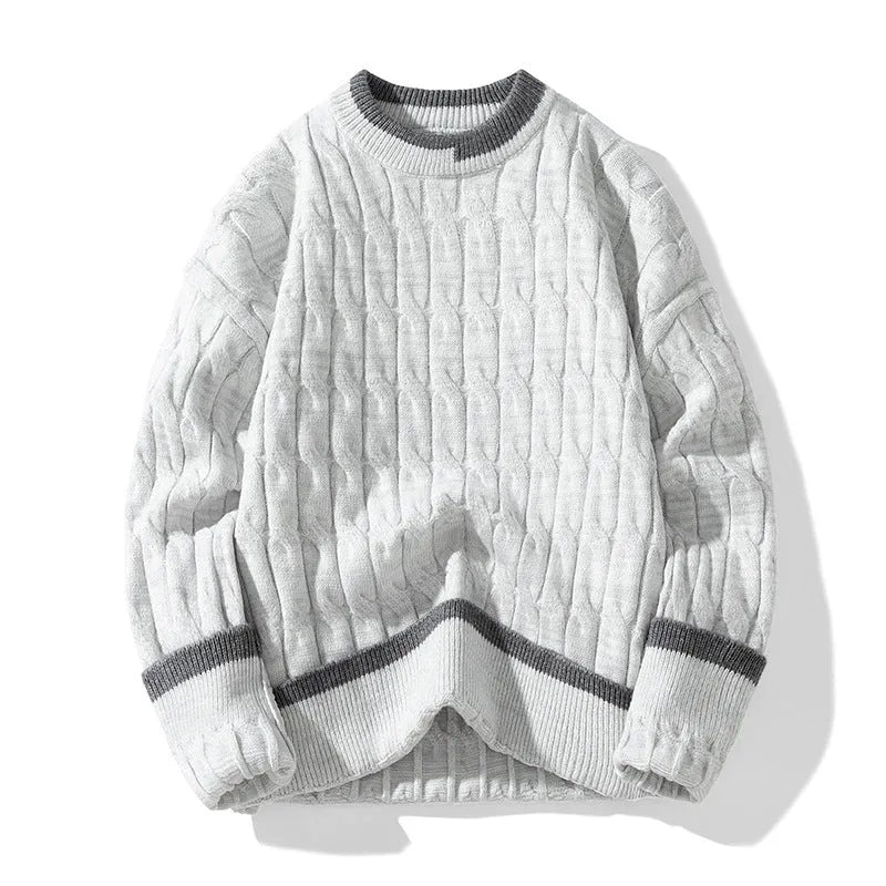 Man wearing a loose-fit, light blue, long sleeve two-piece acrylic sweater set